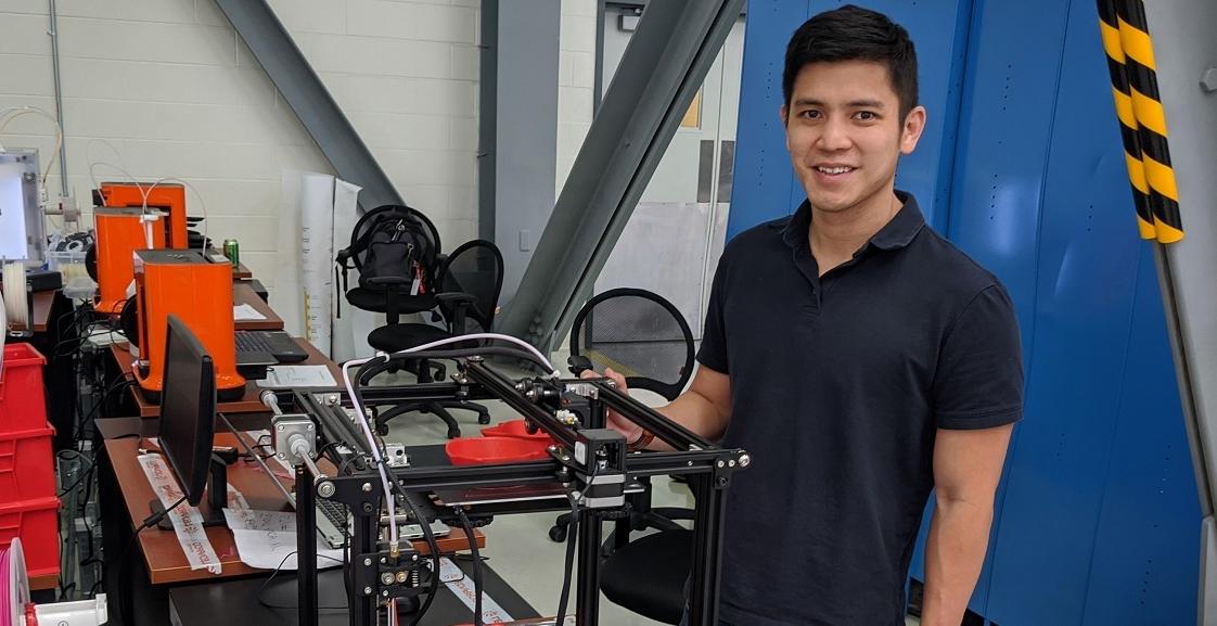 John Ding, who earned a master's in business administration from the University of South Alabama's Mitchell College of Business, is an aircraft engineer at Airbus and part of a team making medical masks for USA Health using 3D printers. Photo courtesy of Airbus. 